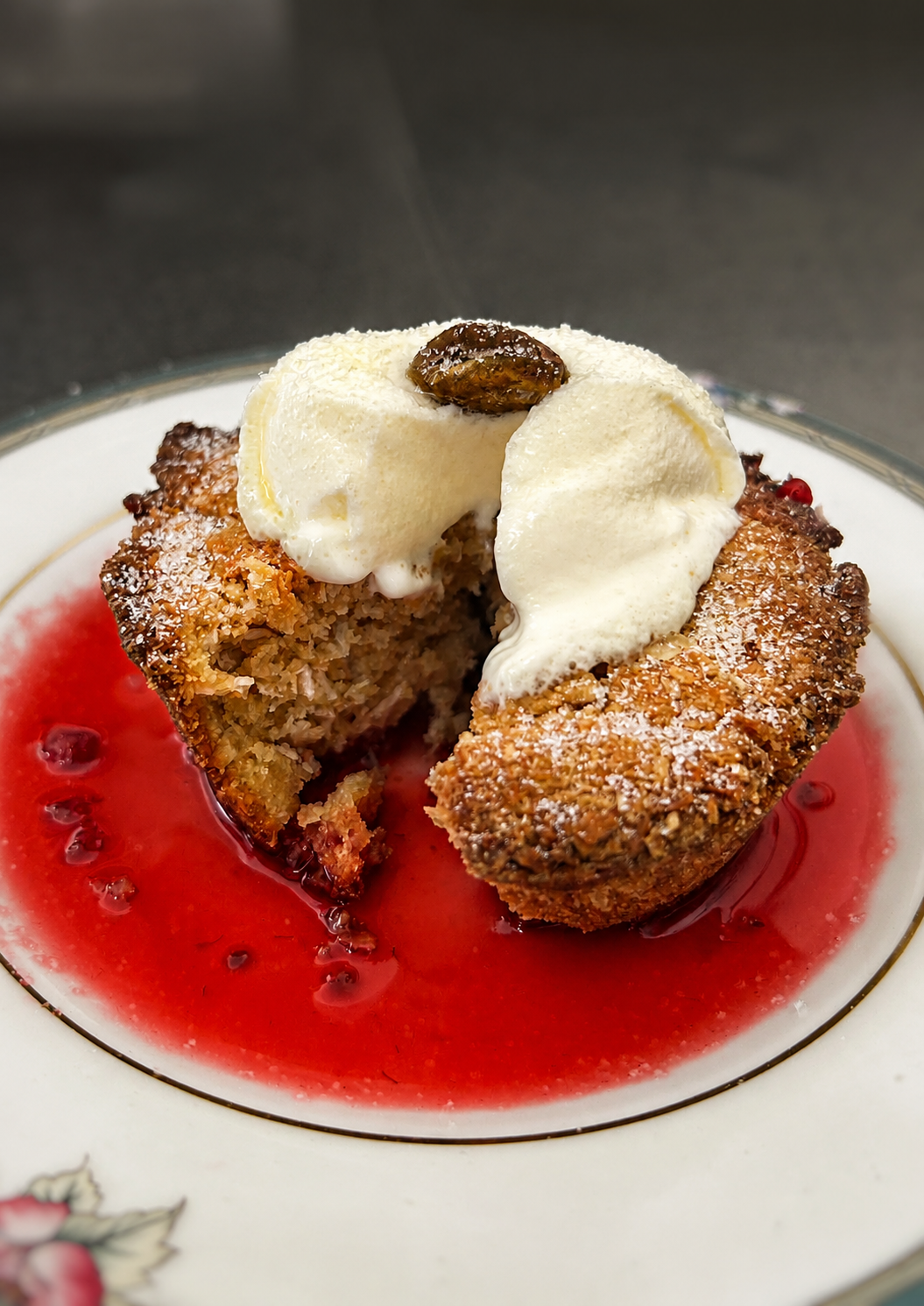 Warm dessert with cream and berry sauce